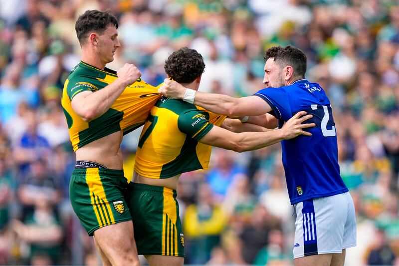 Paudie Clifford of Kerry (right) scuffles with Donegal's Michael Langan (left) and Finnbarr Roarty. Photograph: James Lawlor/Inpho