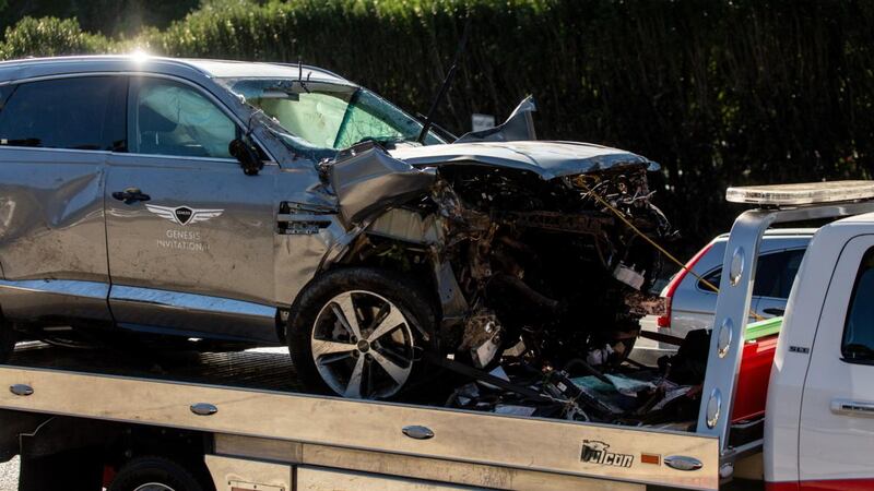 Tiger Woods’s car is taken away on a tow truck after Tuesday’s crash at Rancho Palos Verdes in  California. Photograph: Allison Zaucha/The New York Times