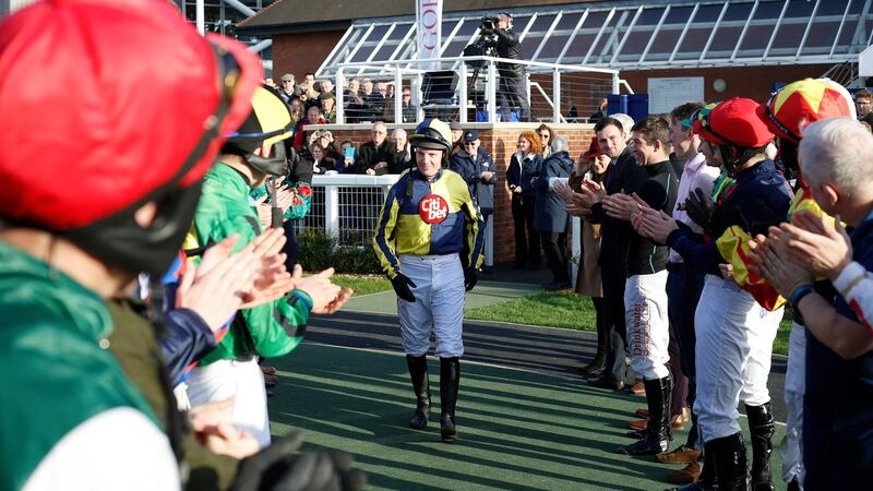 Noel Fehily  gets a guard of honour from his fellow jockeys as he heads out to take the  final ride of his career on  Get In The Queue at Newbury. Photograph:  Julian Herbert/PA Wire