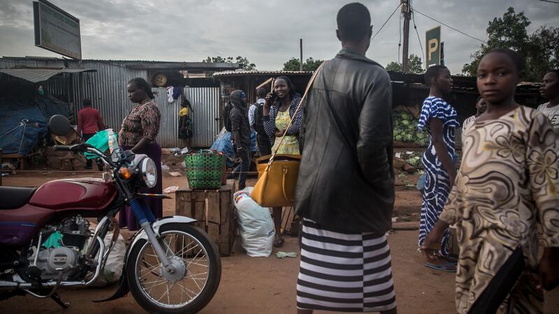 Residents walk near a market in Gulu, northern Uganda. Restrictions are increasing because of the coronavirus outbreak. Photograph: Sally Hayden
