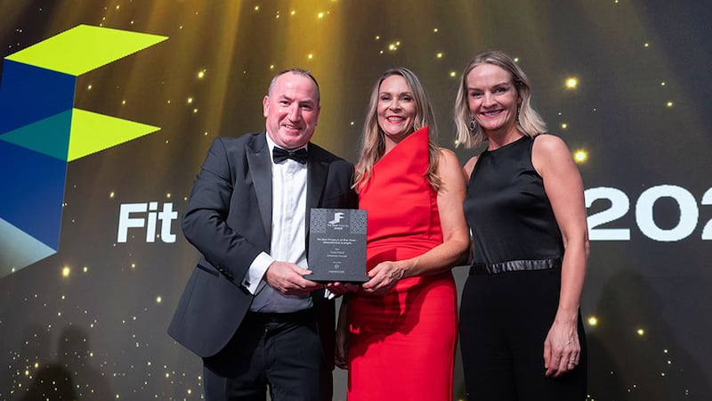 John Flannery, managing director at Havwoods, presents the fit out project of the year - residential (large) award to Joanne Reilly, Total Fitout and Bennary Smith, Grayling Properties