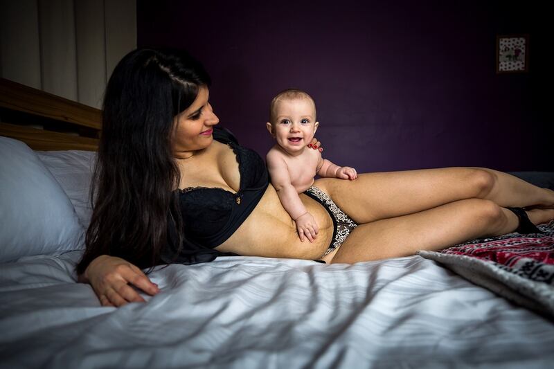 Amanda Ponte, from Swords, Co Dublin, with her son Tagh Cook. The image is part of a photographic campaign to be launched on December 1st. Marian Kennedy, founder of anewmum, teamed up with US photographer 
  Neely Ker-Fox for the celebration of the postpartum body.