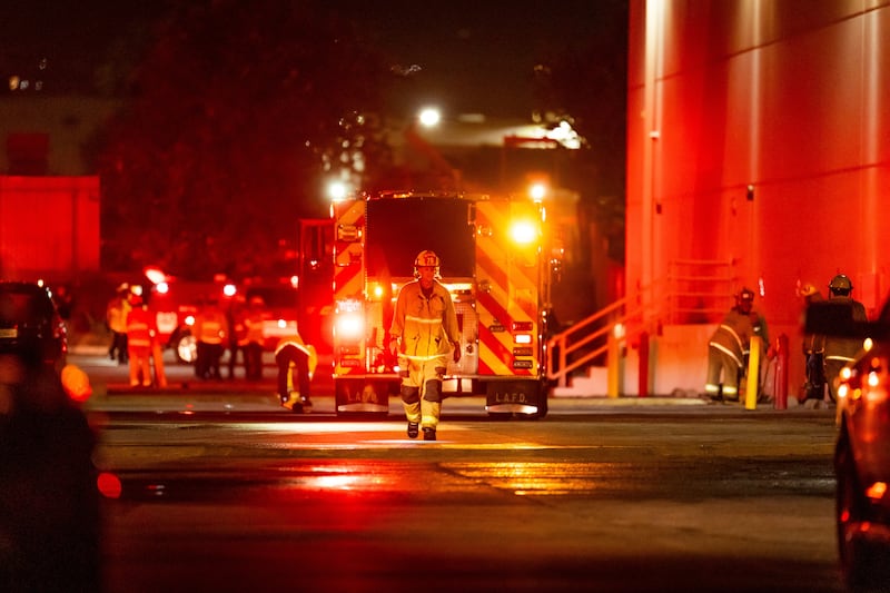 First responders near the scene of the crash. Photograph: Ethan Swope/AP