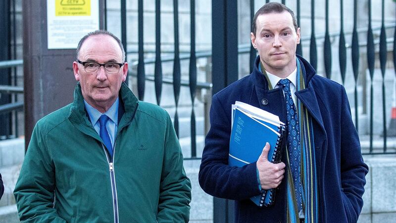 John Corcoran (63), of Nenagh, Co Tipperary, with his solicitor, Seán Fitzgerald leaving the High Court after his case. Photograph: Collins Courts