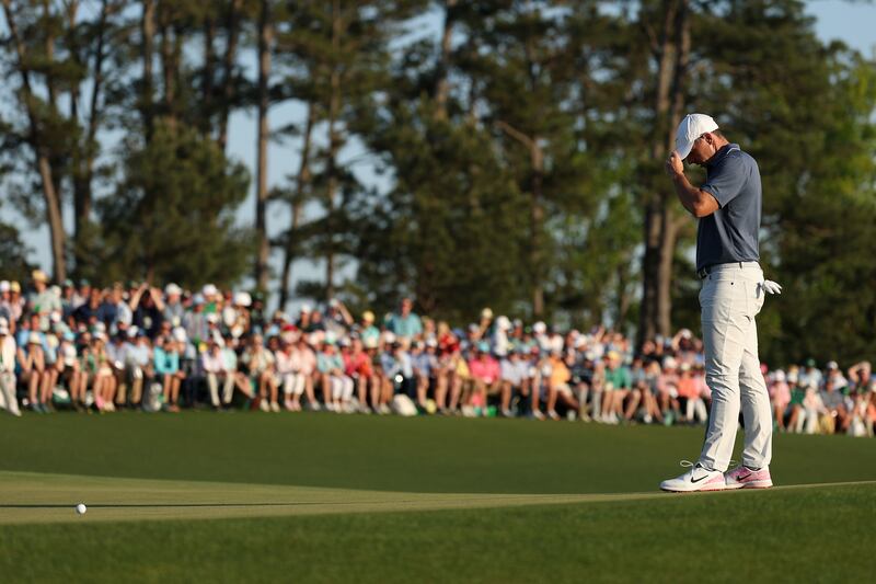 Rory McIlroy, having found the bunker with his  second, misses a par putt and must play off with Justin Rose. Photograph: Richard Heathcote/Getty Images