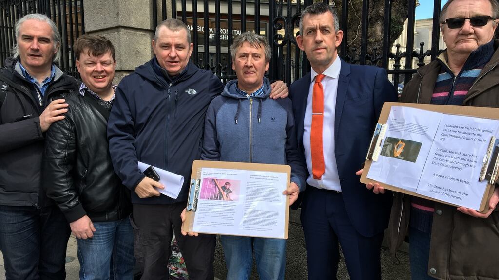 John Allen (third from left) and other members of campaign group for victims of school child abuse, outside Leinster House. They are joined by Sinn Féin TD Maurice Quinlivan (second from right).