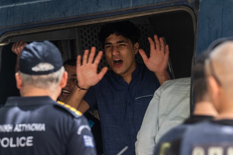 One of the  men accused of people smuggling and causing a shipwreck off Greece in June reacts after the court dropped all charges. Photograph: Angelos Tzortzinis/AFP via Getty Images