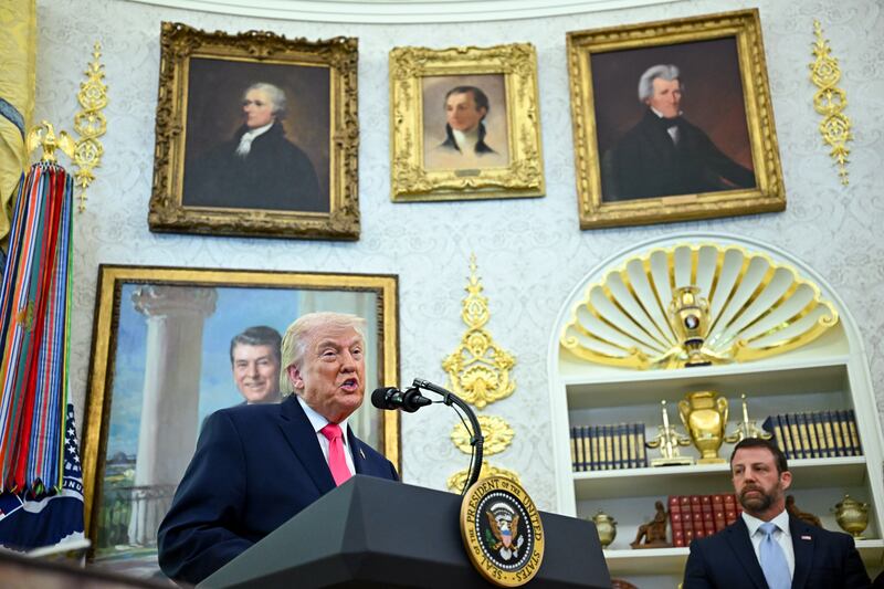 US president Donald Trump and Markwayne Mullin, secretary of the US department of homeland security, during a swearing-in ceremony in the Oval Office on Tuesday. Photograph: Graeme Sloan/Bloomberg