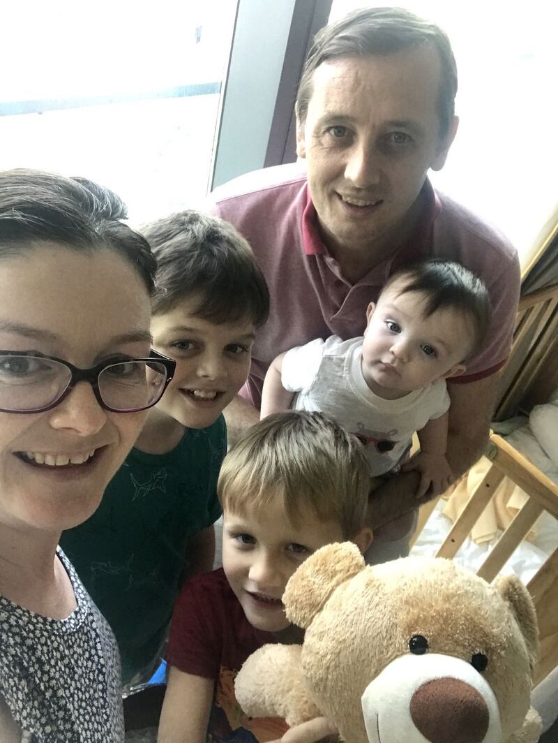 Neasa Neary with her husband and three children, who quarantined in Singapore