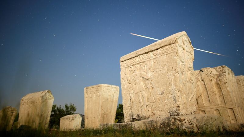 A meteor streaks past stars in the night sky above medieval tombstones during the Perseid meteor shower in Radimlja near Stolac, Bosnia and Herzegovina. Photograph: Reuters/Dado Ruvic