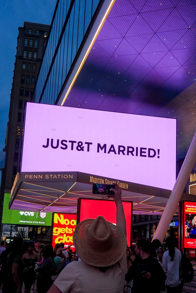 A sign announcing the marriage of Taylor Swift and Travis Kelce outside Madison Square Garden in New York. Photograph: Jutharat Pinyodoonyachet/The New York Times