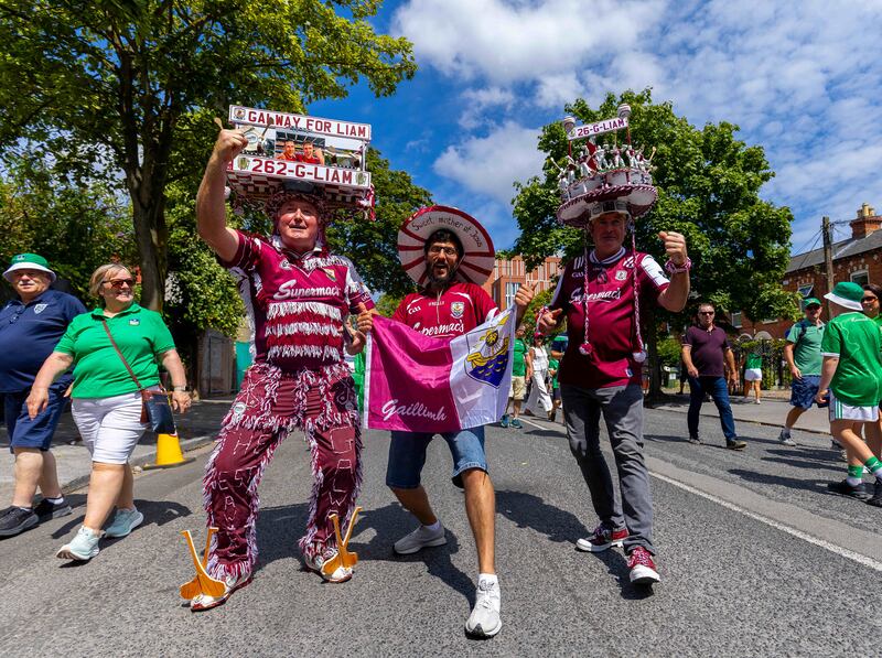 Galway fans flanked by Limerick supporters on their way to the All-Ireland final in Croke Park. Photograph: Tom O’Hanlon/Inpho