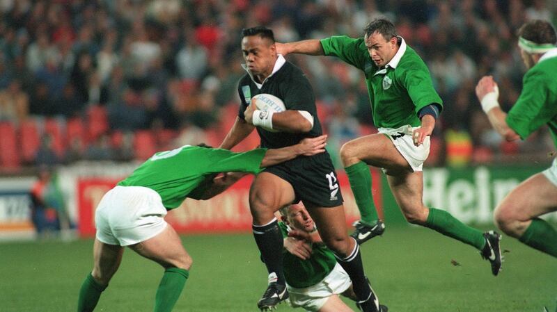 Jonah Lomu runs through Ireland’s defence during the 1995 Rugby World Cup. Photograph: Billy Stickland/Inpho