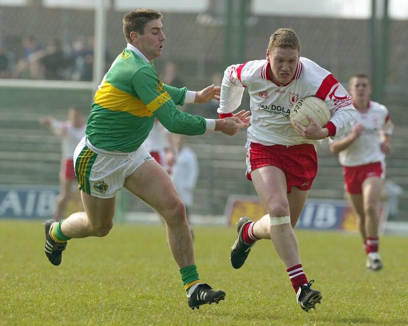 Cormac McAnallen of Tyrone is tackled by Kerry's Darragh Ó Sé during the league clash in Killarney. Ó Sé stormed into the game in the second half, making many clean catches at midfield, but Tyrone prevailed. Photograph: Lorraine O'Sullivan/Inpho