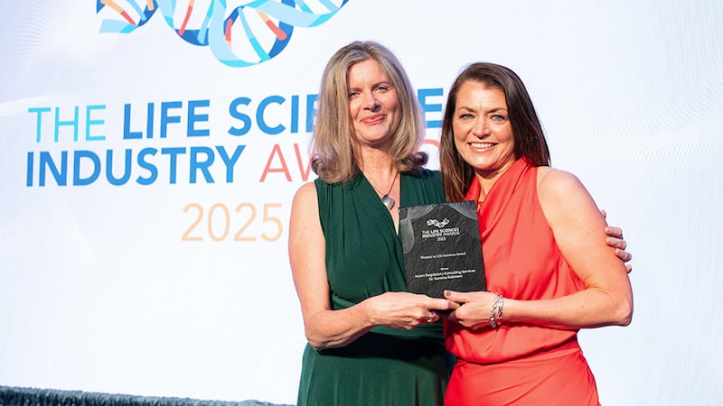 Catherine Giblin, awards judge, presents the women in life sciences award to Dr Gemma Robinson, Acorn Regulatory Consulting Services