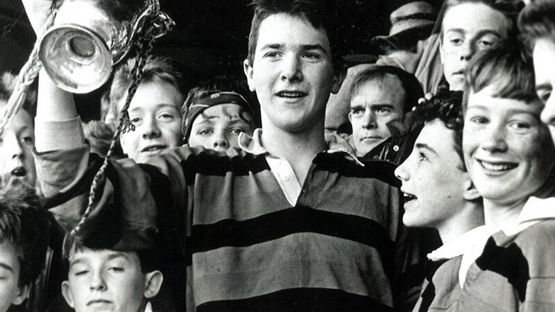 Captain Anthony Foley holds the trophy aloft after St Munchin’s victory in the Munster Junior School’s Cup  in 1989. Photograph courtesy of St Munchin’s College