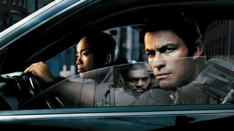 Sonja Sohn, Dominic West and the reflection of Idris Elba in The Wire, the gritty TV show that made Baltimore famous. Photograph: HBO