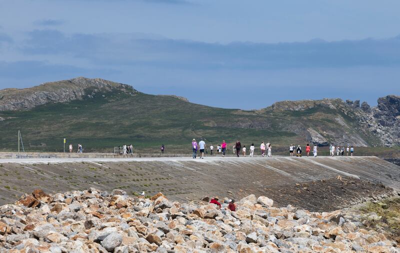 Walking the pier in Howth, Co Dublin. Photograph: Sam Boal/Collins 
