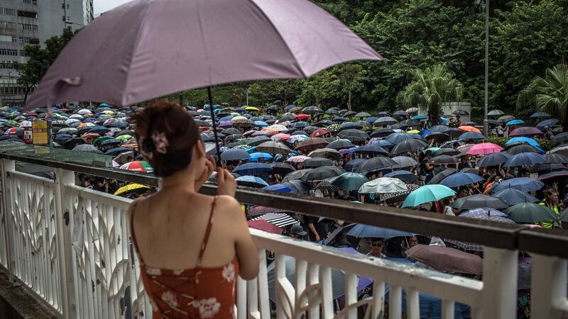 Protesters carrying umbrellas take part in an anti-government march  in Hong Kong, China, on Saturday. Photograph: Roman Pilipey/EPA
