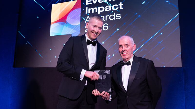 Neil Wall, community director at Business River, presents the outstanding contribution award to Francis Joseph Quigley, Corporate Audio Visual Services