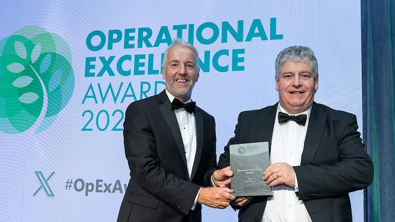 Brian Coll, awards judge (judging coordinator), presents the operational excellence leader award to Willie Murphy, Aurivo