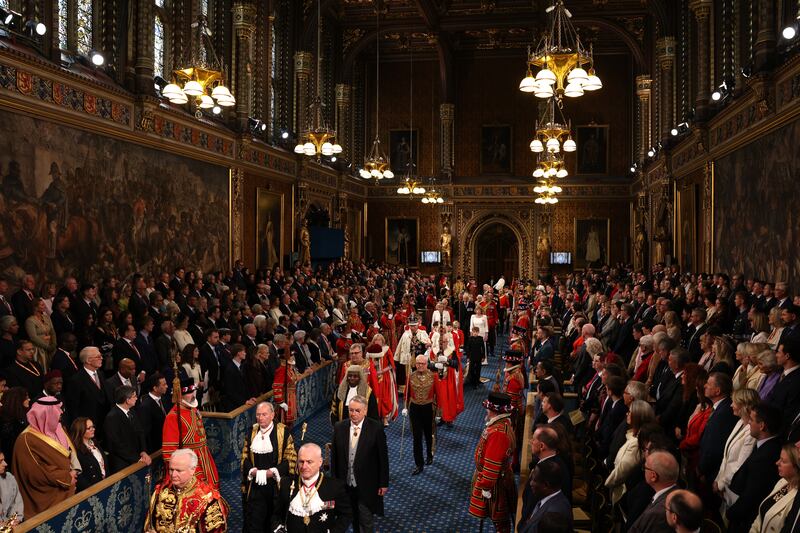 Britain's king Charles and queen Camilla, walk through the Royal Gallery during the State opening of parliament, in the House of Lords at the Palace of Westminster in London. Photograph: Adrian Dennis/PA Wire