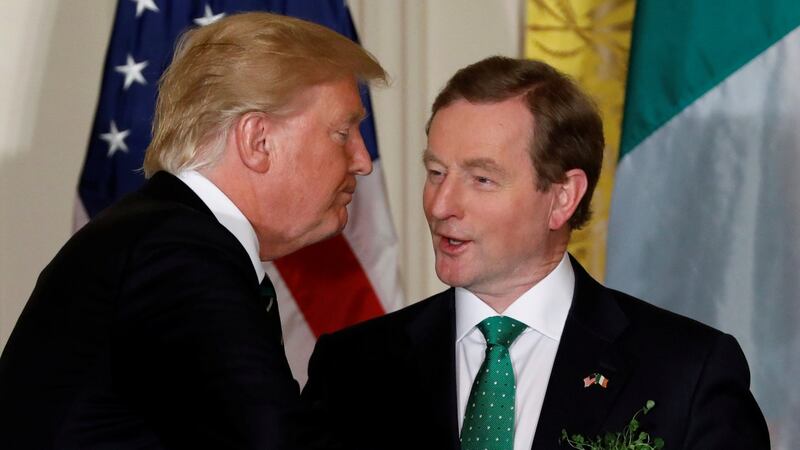 President Donald Trump speaks with Taoiseach Enda Kenny at a St Patrick’s Day reception at the White House. Photograph: Jonathan Ernst/Reuters
