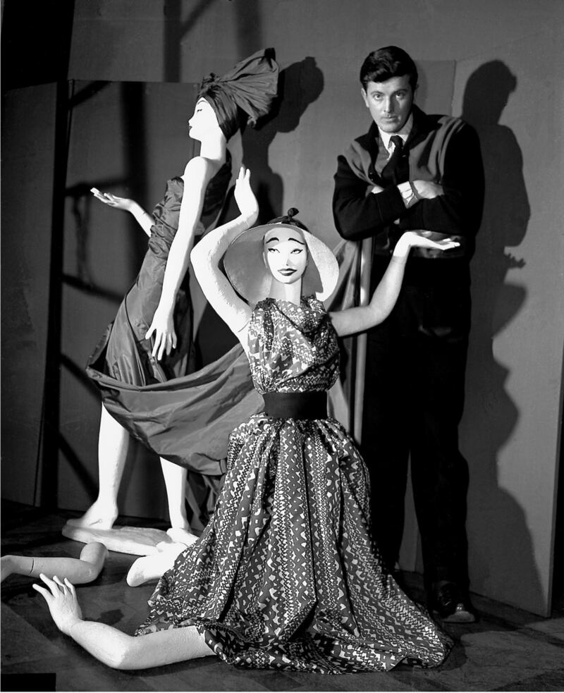 Givenchy poses with mannequins in his shop in Paris, February, 1952. Photograph: AP