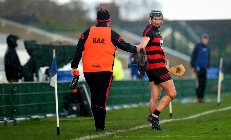 Ballygunner’s Pauric Mahony dries off his hurl. Photograph: Ryan Byrne/Inpho
