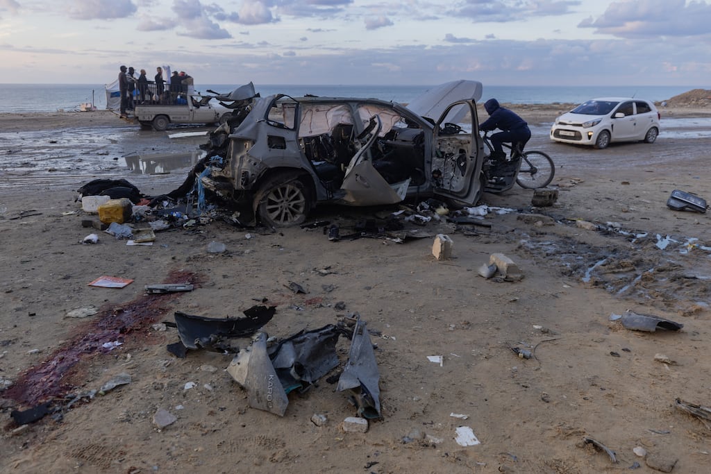 A destroyed car following an Israeli strike in Gaza City on Saturday.(Photo: Saher Alghorra/The New York Times)