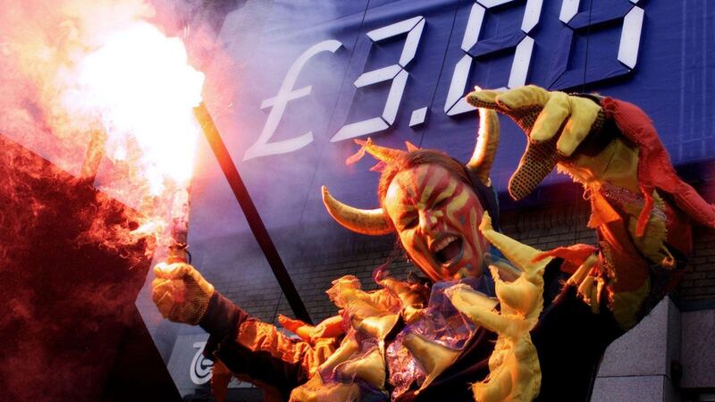 A dancer dressed as a dragon burns a flare in front of the launched Telecom Éireann share offer price in Dublin on  July 7th, 1999. Photograph: RTÉ