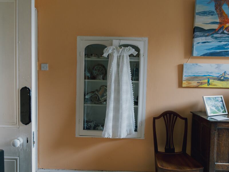 Petronell’s three brothers, were, respectively, Henry Cecil, Cedric Alexander, and Samuel Louis. All four siblings were christened in the pristine bone-white robe that hangs from the cabinet wall. Photograph: Dan Dennison