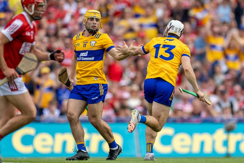Clare’s Aidan McCarthy celebrates scoring a goal with teammate Mark Rodgers. Photograph: Morgan Treacy/Inpho