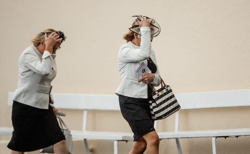 Hold on to your hats: A windy time of it on the second day of the  Galway Racing Festival at Ballybrit. Photograph: James Crombie/Inpho