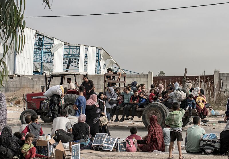 Palestinians evacuating to the southern Gaza Strip, make their way along Salah al-Din Street in Bureij, on Saturday. Photograph: Haitham Imad/EPA