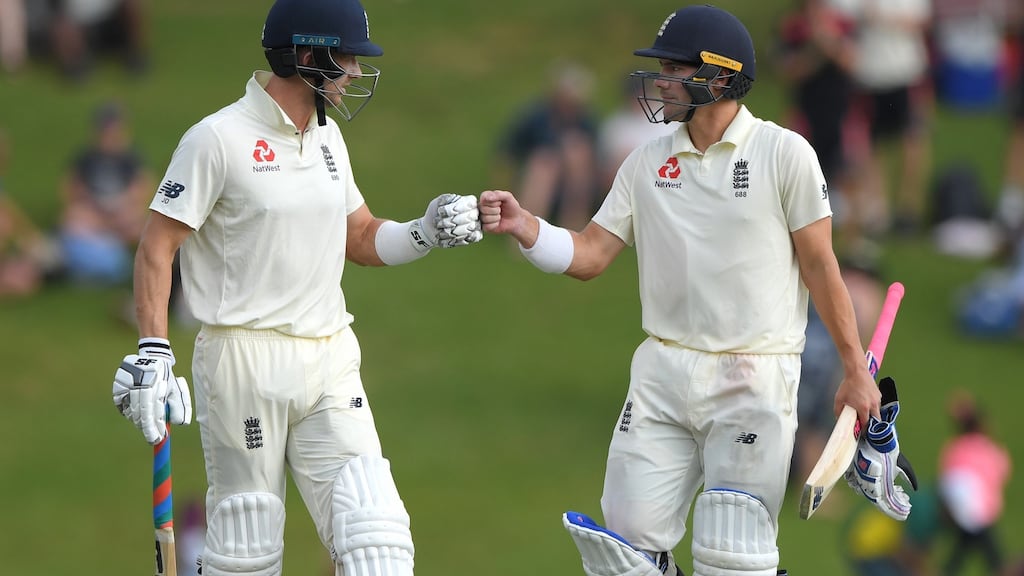 England batsmen Joe Denly  and Rory Burns touch gloves as play finishes for the day with both batsmen still at the crease after day three of the first Test at SuperSport Park  in Pretoria. Photograph: Stu Forster/Getty Images