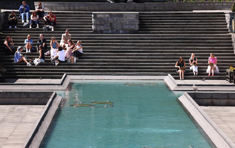 Enjoying the good weather in Garden of Remembrance, Dublin on Thursday. Photograph: Dara Mac Dónail









