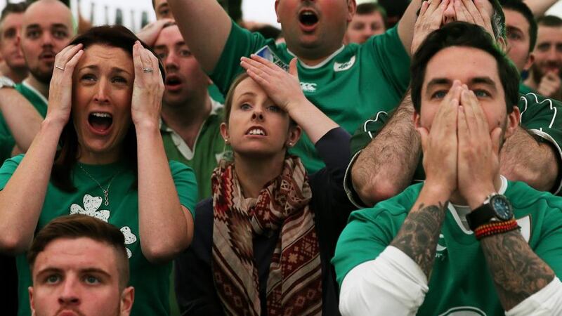 Ireland rugby supporters get a taste of looming Rugby World Cup doom in the quarter final against Argentina,  at the Irish rugby village in the IFSC, Dublin. Photograph: Brian Lawless/PA Wire.
