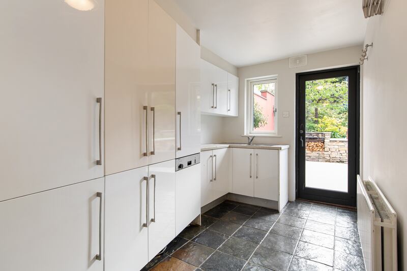 There is a large utility room off the kitchen