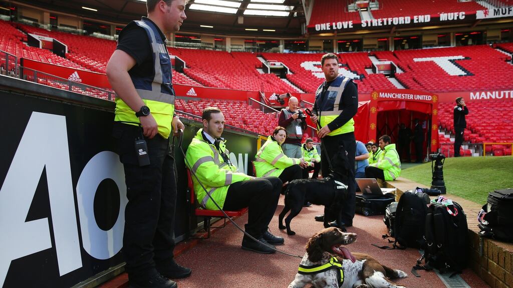 A patrol team at Old Trafford in Manchester after the Premier League match between Manchester United and Bournemouth was abandoned due to a suspect device. Photograph: Alex Livesey/Getty Images