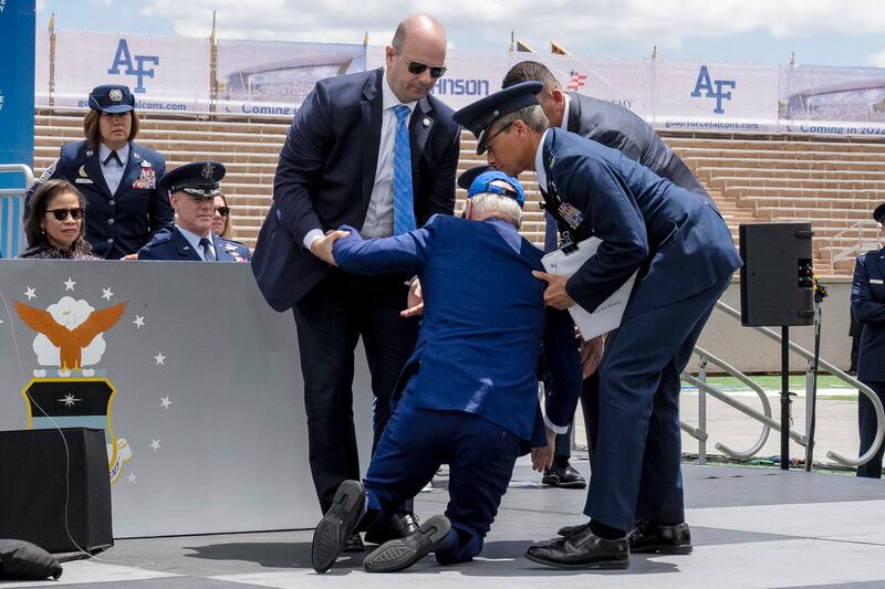 Biden was helped up by an air force officer and two members of his secret service detail. Photograph: Andrew Harnik/AP