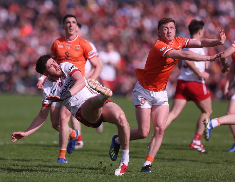 Tyrone's Joe Oguz with Armagh's Ross McQuillan.
Photograph: John McVitty/Inpho