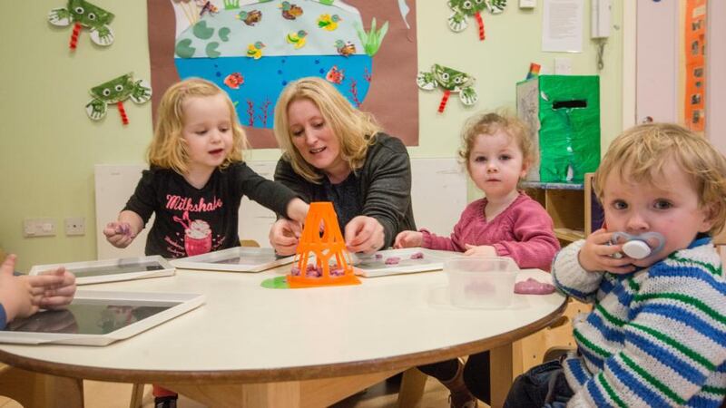 Catherine O’Reilly in the toddler room in the Island Key Childcare and Community Service, East Road Dublin 3. Photograph: Brenda Fitzsimons