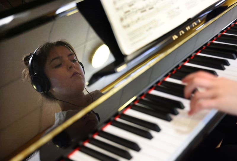 Ava Duffy (18) from Dingle, Co Kerry rehearses on piano before taking part in the John Benson Memorial Cup section of the annual Feis Ceoil. Photograph: Bryan O’Brien/The Irish Times 