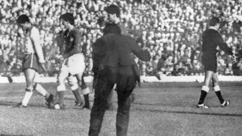 Brazilian forward Garrincha (L), surrounded by Chilean players, leaves the field after being sent off by Peruvian referee Arturo Yamasaki in the semi-finals. Photograph: Staff/AFP