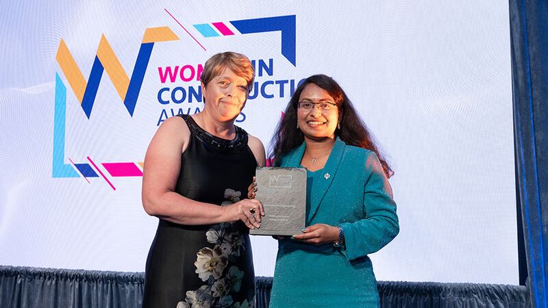 Susan Cormican, awards judge, presents the excellence in engineering award to Ramya Janardhan, McElroy Associates