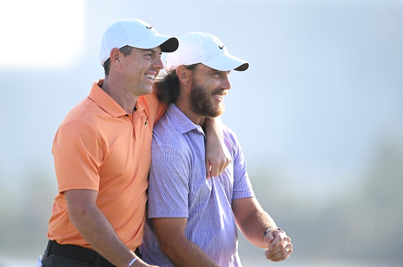 Rory McIlroy of Northern Ireland and Tommy Fleetwood of England embrace on the 18th green as Fleetwood wins the Dubai Invitational in January. Photograph: Alex Burstow/Getty Images