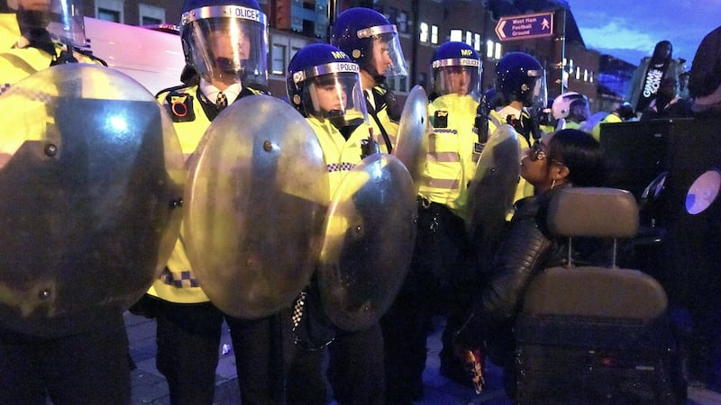 Police officers in Forest Gate, north east London, during the clashes. Photograph: PA