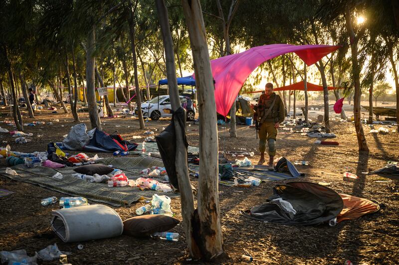 Members of the Israeli security forces continue to search for identification and personal effects at the Supernova Music Festival site, where hundreds were killed and dozens taken hostage by Hamas militants near the border with Gaza. Photograph: Leon Neal/Getty Images