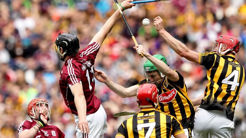Galway’s Joseph Cooney in action against Kilkenny’s Robert Lennon and Joey Holden  during the 2016 Leinster hurling  final. Photograph: Ryan Byrne/Inpho